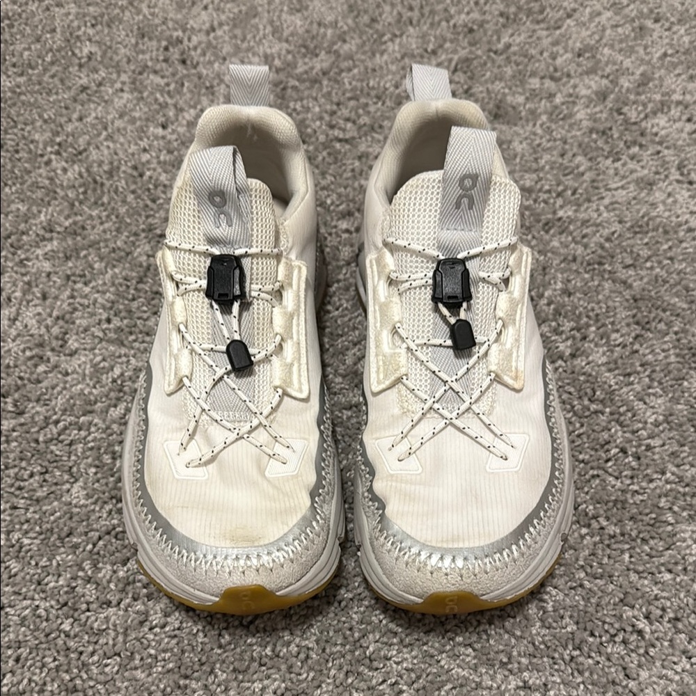 On runaway White and Gray Sneakers